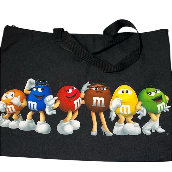 M&M'S Handbags - M&M's World graphic tote bag featuring several M&M's characters.